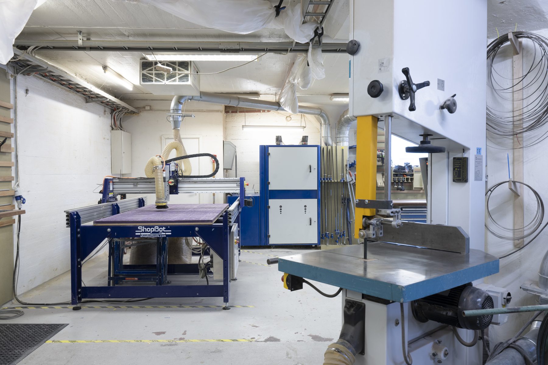 The CNC mill and band saw in the wood workshop